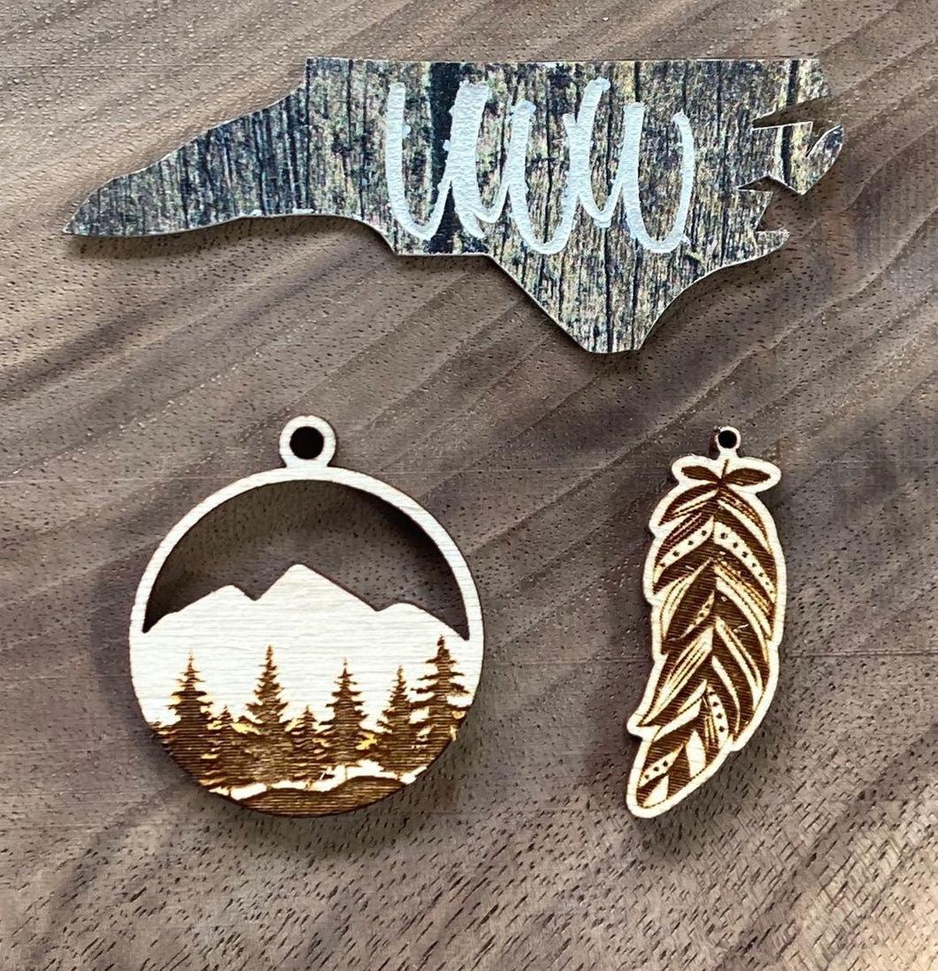 Mountain scene and feather dangle